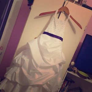 A white and purple wedding dress worn once